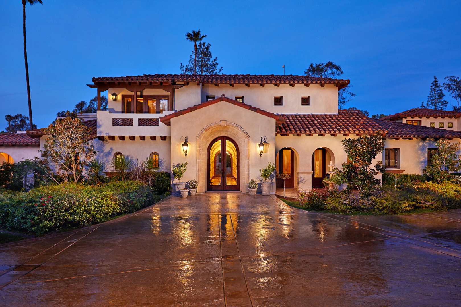 Front view of luxury mediterranean home at twilight, Rancho Santa Fe CA