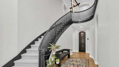 Grand entryway with custom staircase
